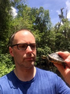 Tim Walsh inspecting a young Suwannee cooter during fieldwork in Florida. Photo by Timothy J Walsh